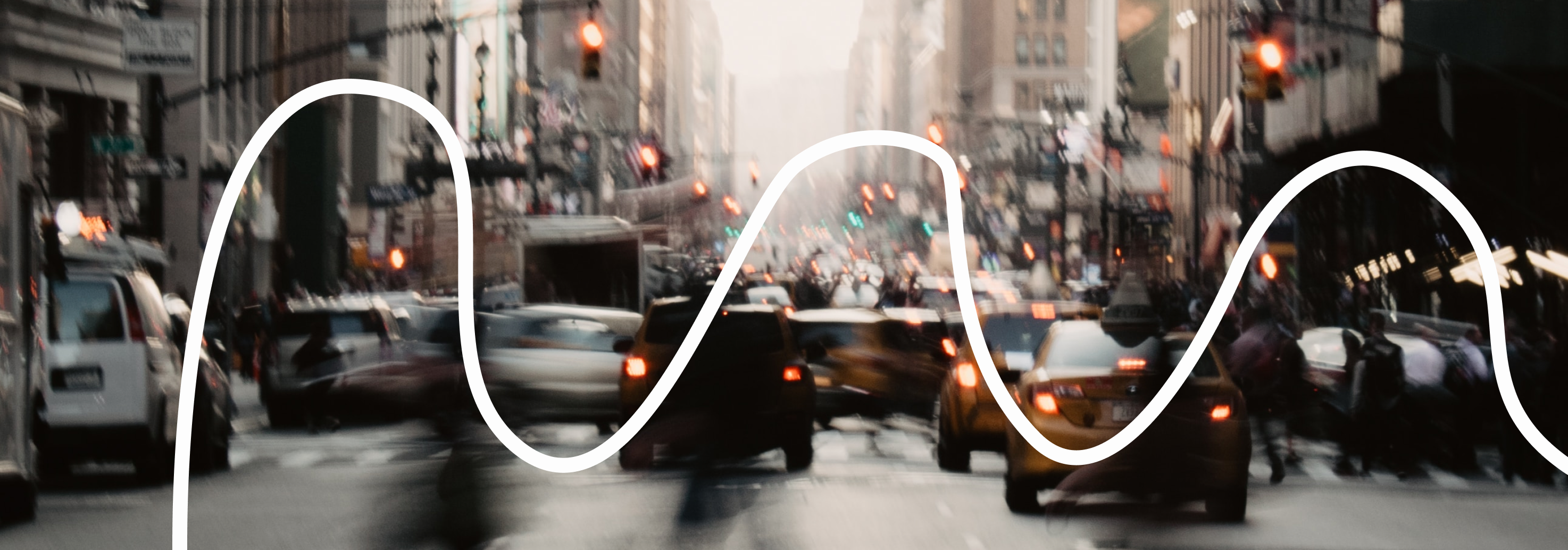 Blurred image of a busy street with scribble graphic overlay